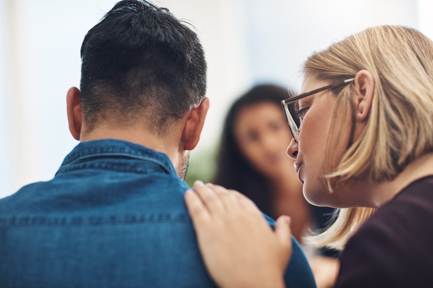 woman silently talking beside husband, concept of trauma and healing