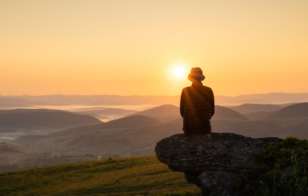 alone on the edge of the mountain hill, concept of mindfulness, peace, healing