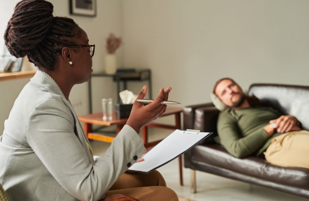 psychologist talking to patient at office